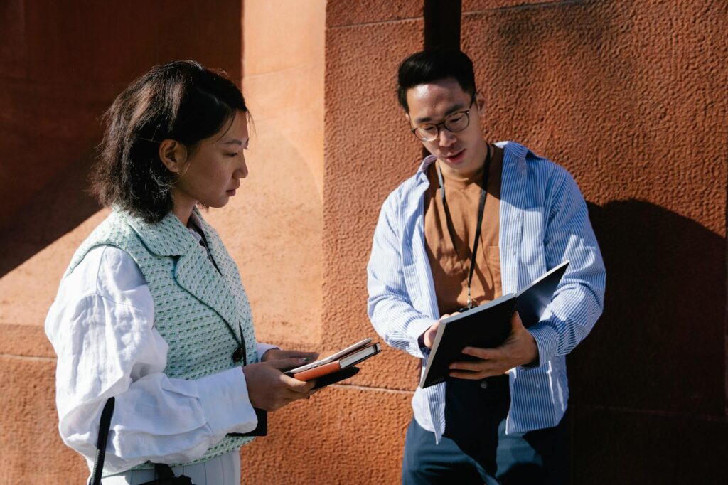 man showing a document on a woman